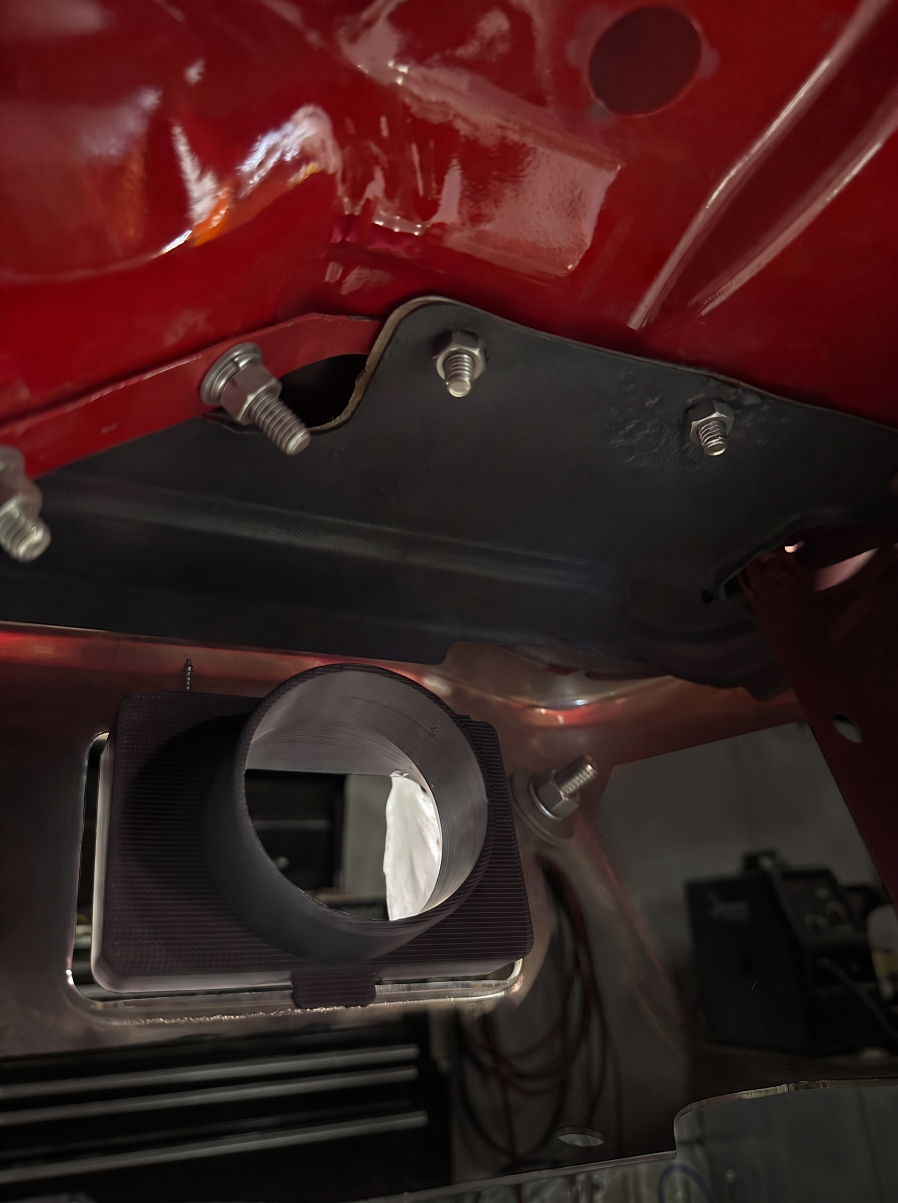 Underside view of the prototype brake cooling duct behind the Nova bumper opening, digitally recolored black
